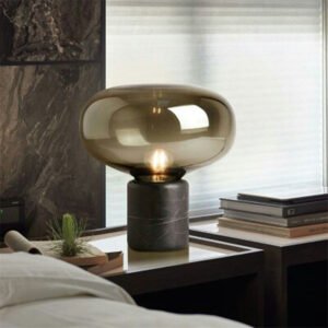 Modern elegant table lamp with a fusion of transparent glass and stone base