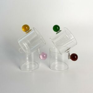 Scandinavian style glass cup with colored glass hand detail